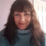 Vicky Tunaley wearing a light blue jumper and smiling.