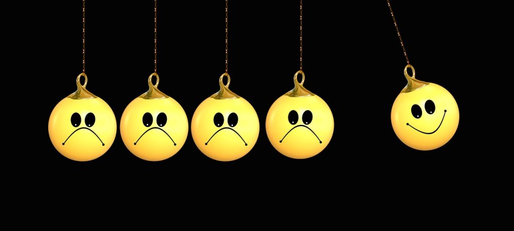 Lots of unhappy faced balls and one happy face ball