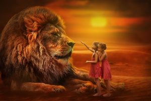 Large lion being approached by two little girls. Red sunset. Used on therapy website, Trance for a Change Hypnotherapy to show courage.