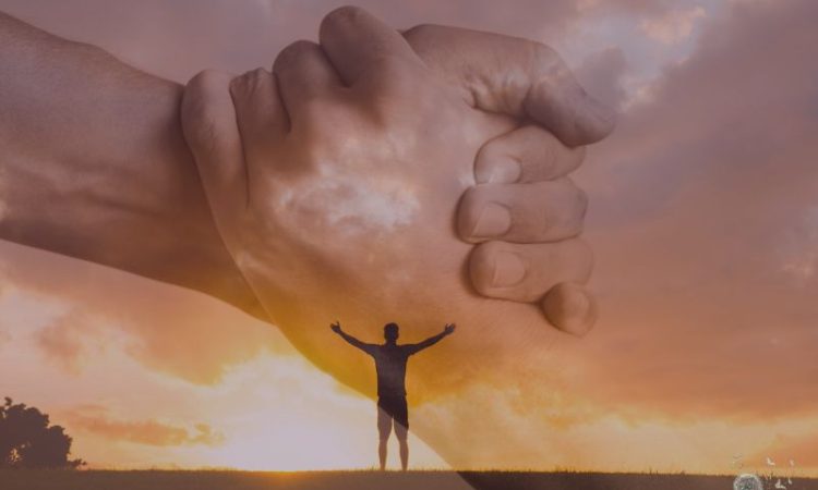 Comfort - hands grasping each other in support.